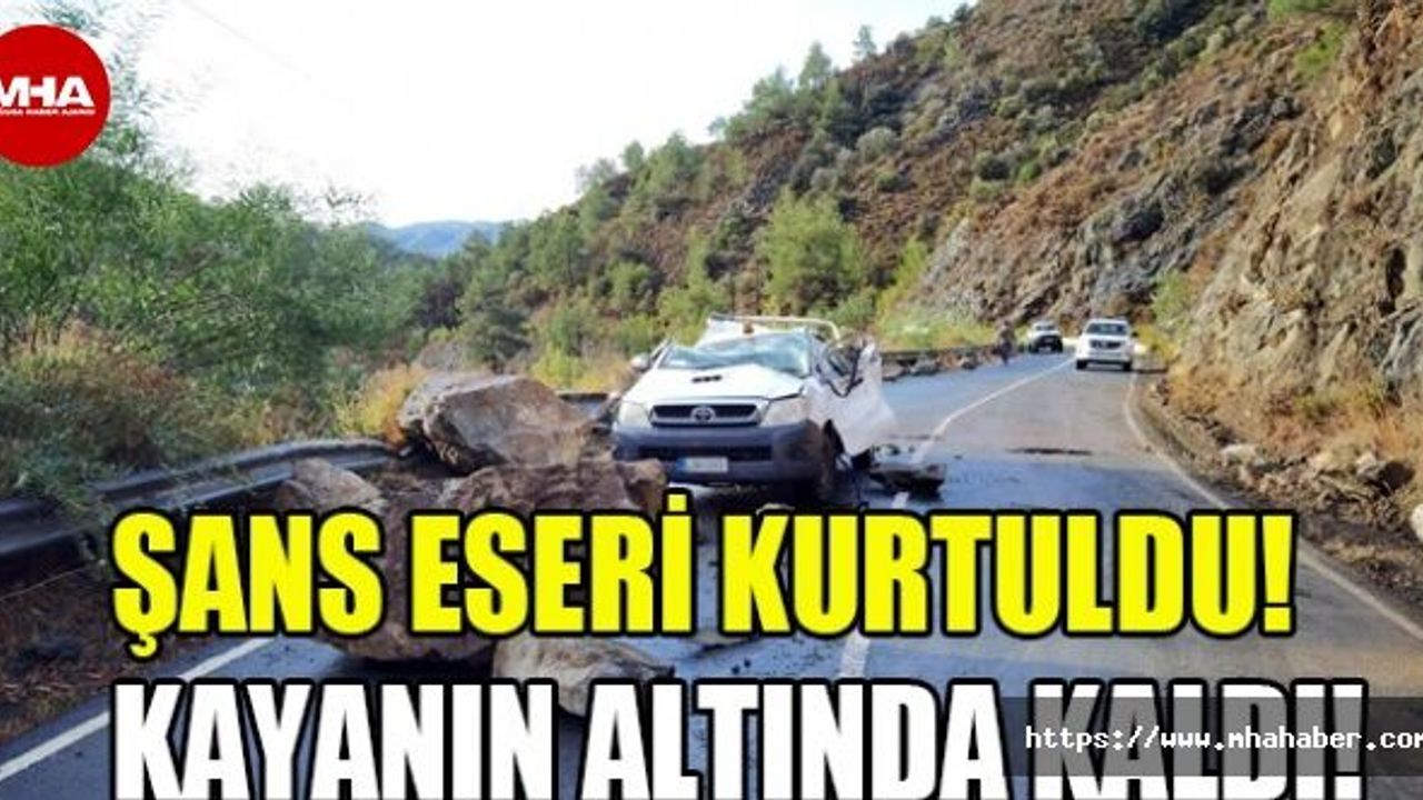 DAĞDAN KOPAN KAYA PARÇASI ARACIN ÜSTÜNE DÜŞTÜ!