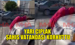 Çıplak vatandaş araba üstünde sızdı