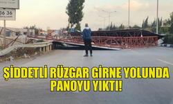 GİRNE'DE ŞİDDETLİ RÜZGAR REKLAM PANOSUNU DEVİRDİ!