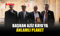 BAŞKAN AZİZ KAYA’YA TEŞEKKÜR VE PLAKET