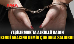 ALKOLLÜ KADIN DEMİR ÇUBUKLA ARACA ZARAR VERDİ