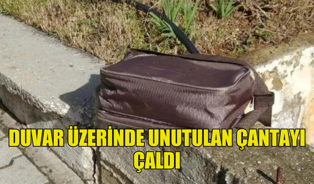 BİR ŞAHIS DUVAR ÜZERİNDE UNUTULAN ÇANTAYI ÇALDI