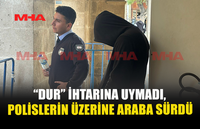 “DUR” İHTARINA UYMADI,POLİSLERİN ÜZERİNE ARABA SÜRDÜ