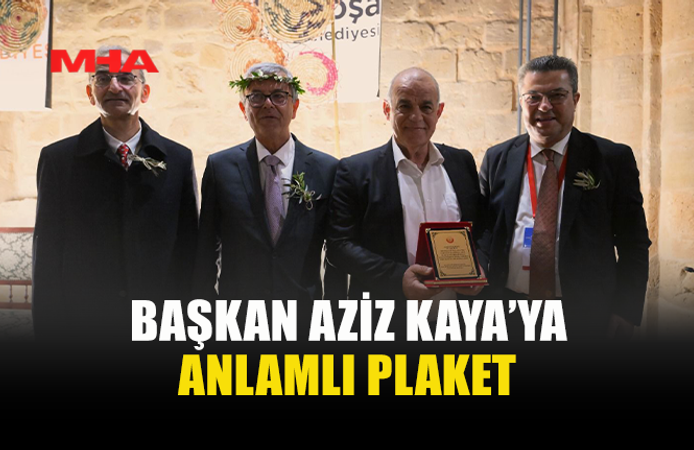 BAŞKAN AZİZ KAYA’YA TEŞEKKÜR VE PLAKET